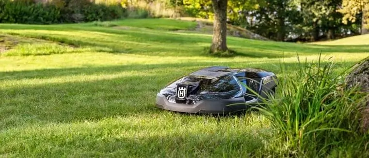 Green Robotic Mower On The Lawn