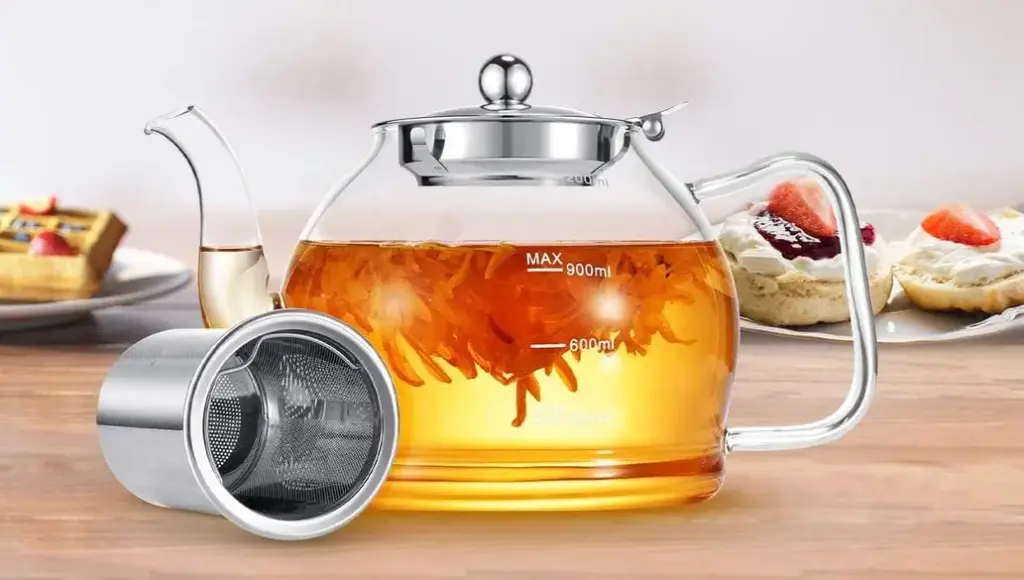 Stntus Glass Teapot On Table