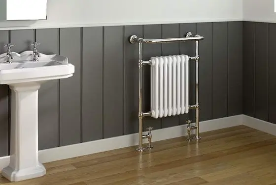 Victorian Heated Towel Rail On Wood Flooring