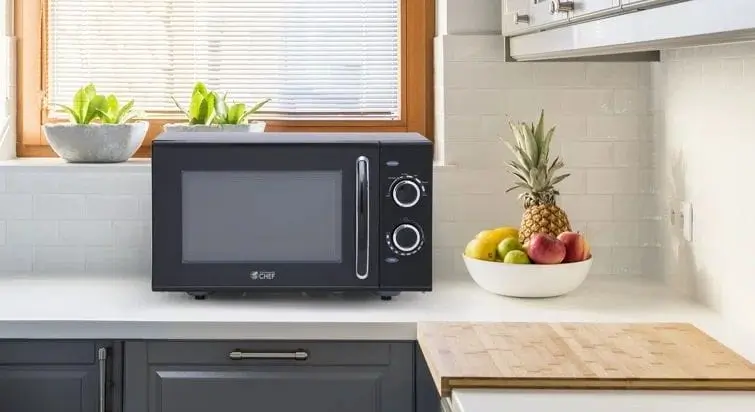 Retro Black Microwave In Kitchen