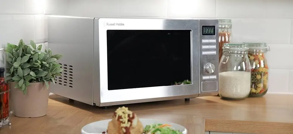 Light Silver Microwave In Kitchen Counter