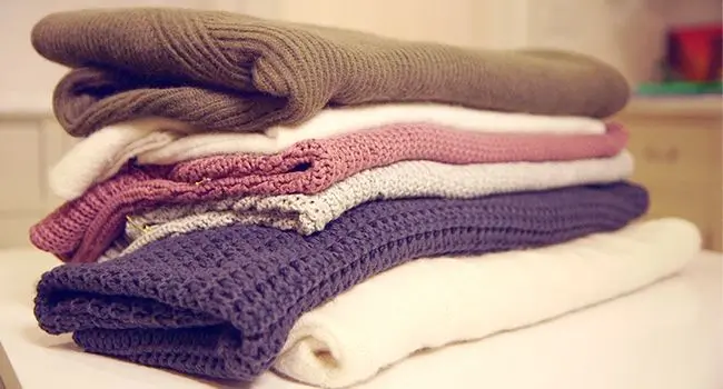 Just A Pile Of Jumpers On Table