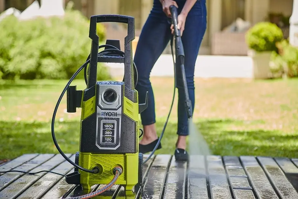 RYOBI Electric Pressure Washer In Yellow And Black On Decking