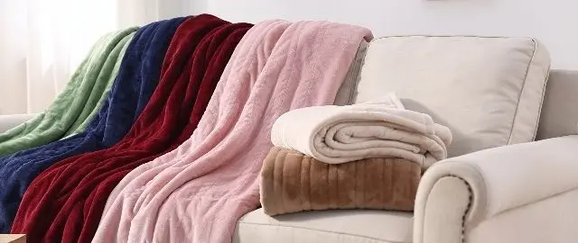 Warm Blankets On Sofa Folded